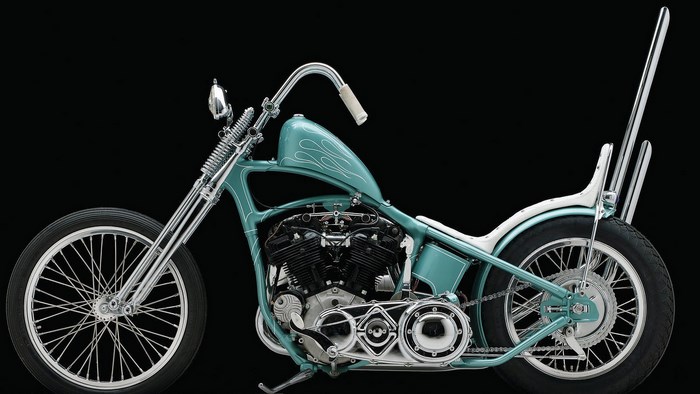 Custom teal chopper motorcycle with chrome accents