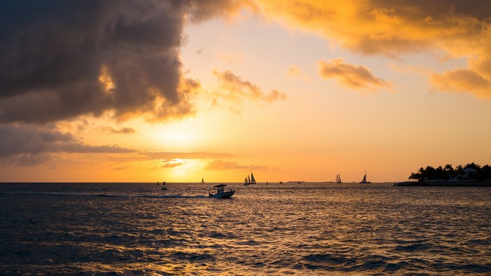 4K Windows Sunset with Sailboats and Boat