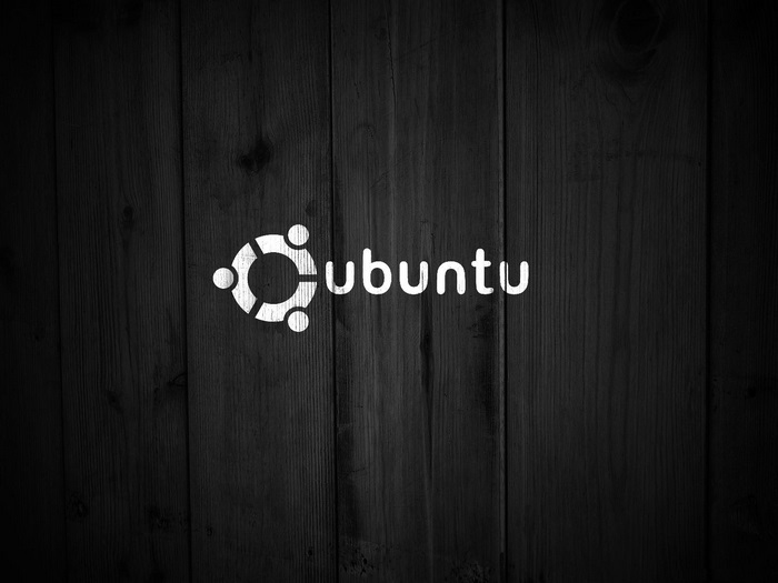 Ubuntu logo on dark wood background