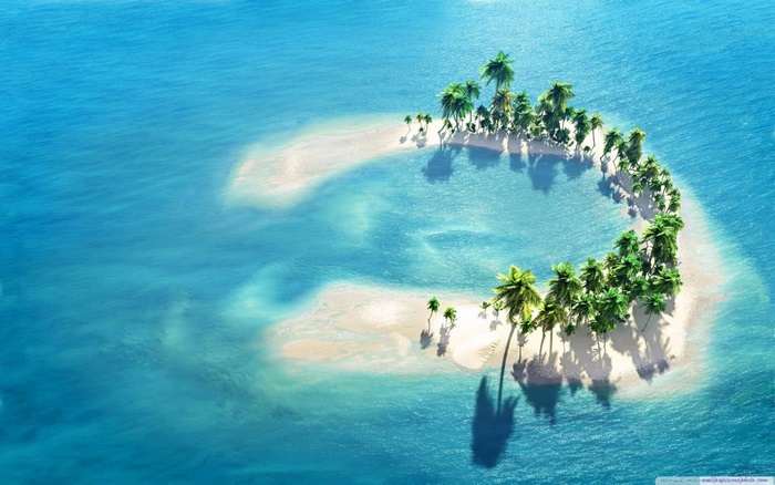 Tropical Island with Palm Trees in Clear Ocean