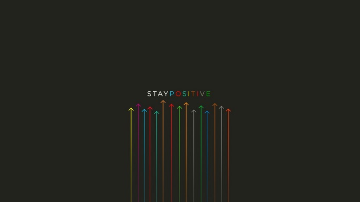 Stay Positive arrows on dark background