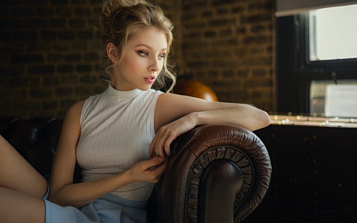 Alice Tarasenko Relaxing on Leather Couch