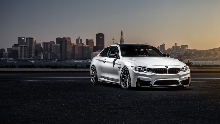 BMW M4 with City Skyline at Sunset 4K