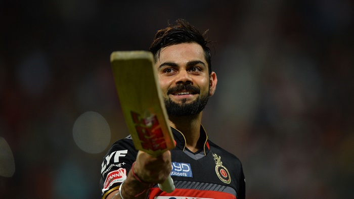 Virat Kohli holding a cricket bat