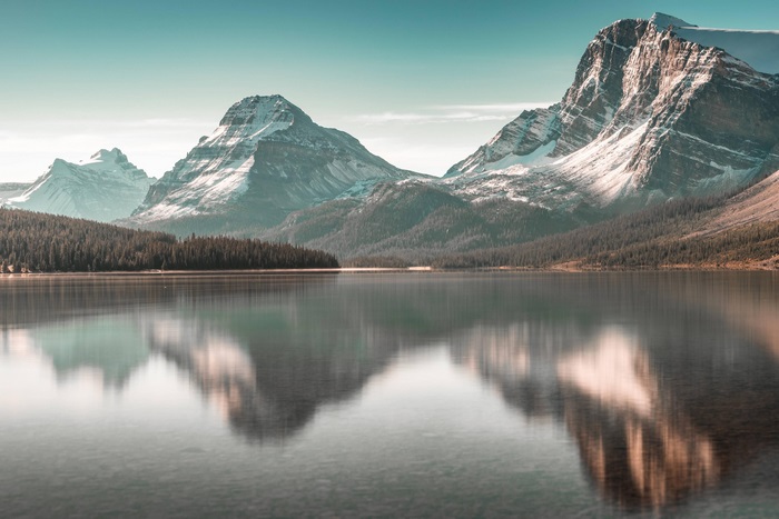 Snow-capped mountains reflected in a lake