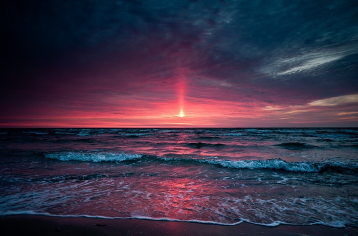 Sunset over the ocean with dramatic sky