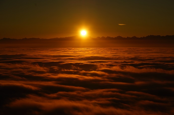 Sunrise over clouds and mountains 4K