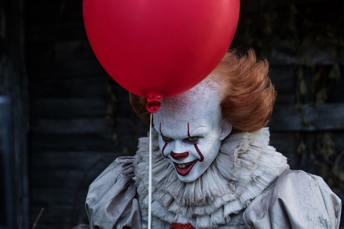 Pennywise the Dancing Clown from It with a red balloon