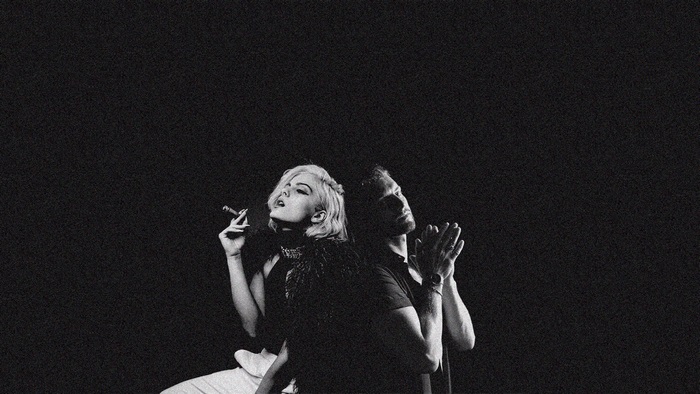 Bebe Rexha and man in black and white