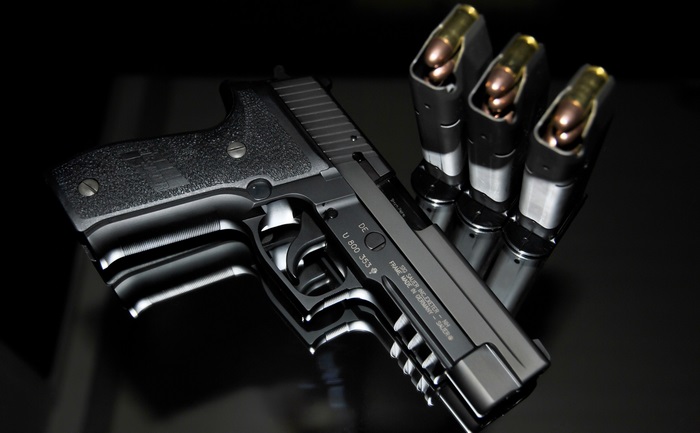 Sig Sauer P226 pistol with magazines