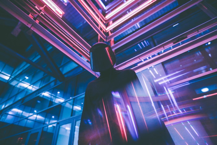Person in VR headset with neon lights