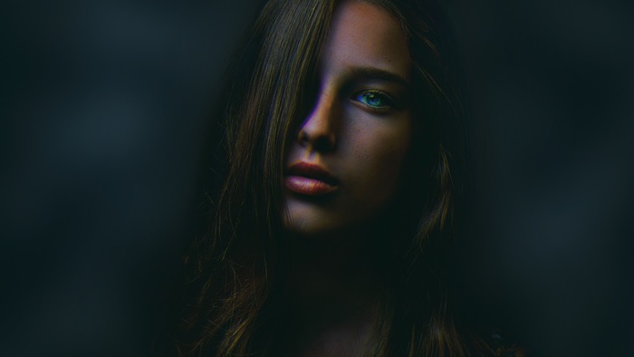 Woman with hair covering face in 4K