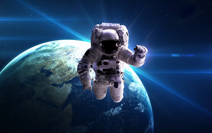 4K Astronaut Floating Above Earth in Space