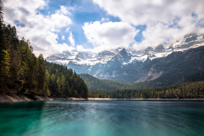 Lake with Snow-Capped Mountains and Forest