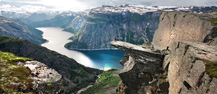 Majestic Rocky Cliff Overlooking Serene Fjord in Norway