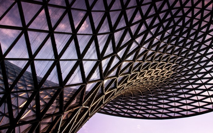 Abstract geometric architecture with purple sky