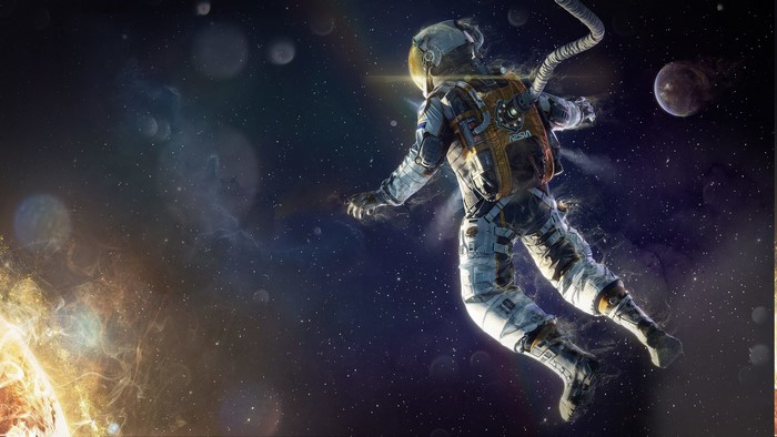 Astronaut floating in space near the sun