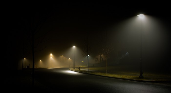 Street lights in the fog at night