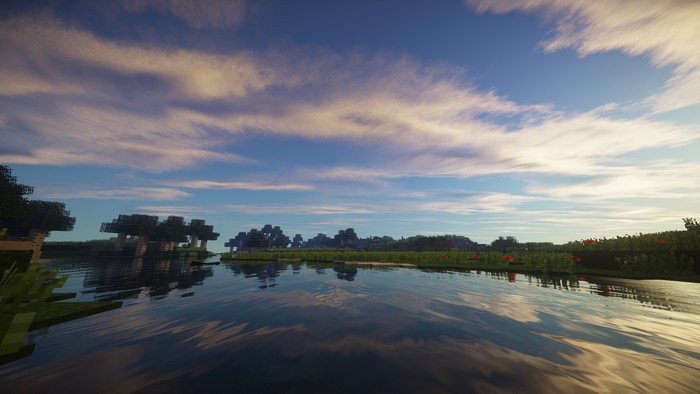 Minecraft landscape with lake and trees at sunset