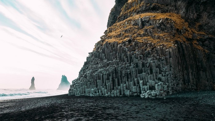 Basalt columns on a black sand beach in Iceland