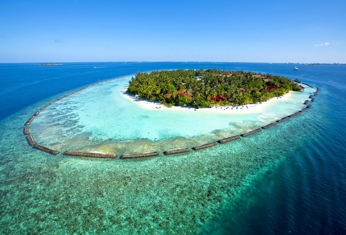 Aerial view of a tropical island resort in the Maldives