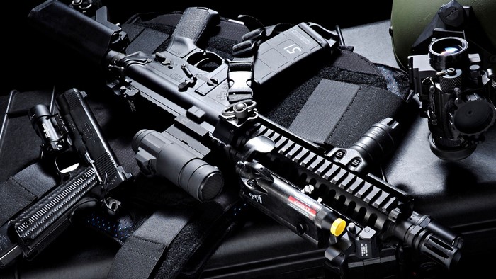 Assault Rifle and Handgun on Tactical Gear