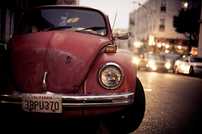 Red Volkswagen Beetle on a City Street