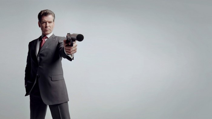 Pierce Brosnan as James Bond holding a gun