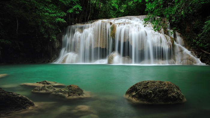 Peaceful waterfall in a lush green forest