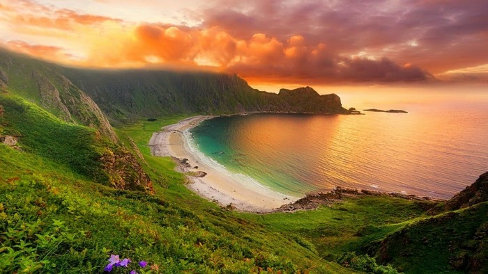 Scenic coastal landscape with mountains and ocean at sunset