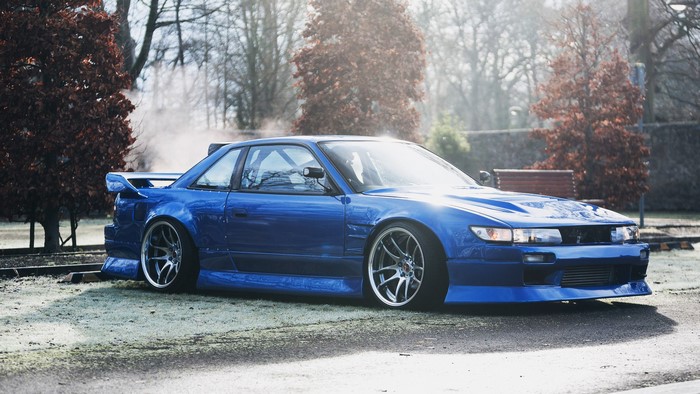 Blue Nissan Silvia S13 with Aggressive Tuning