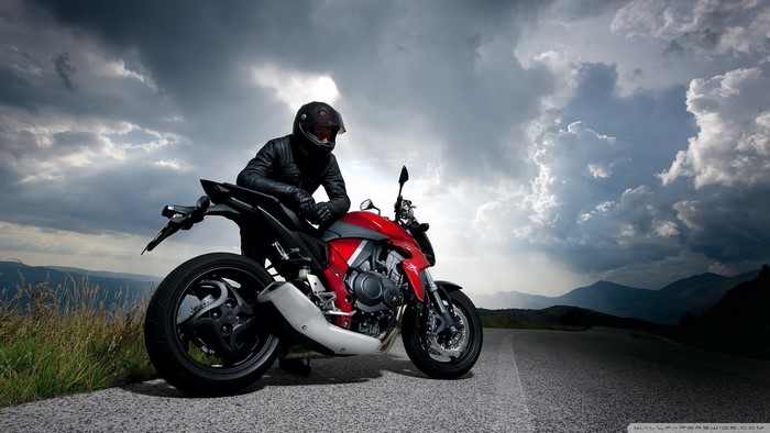 Honda CB1000R motorcycle with rider on mountain road