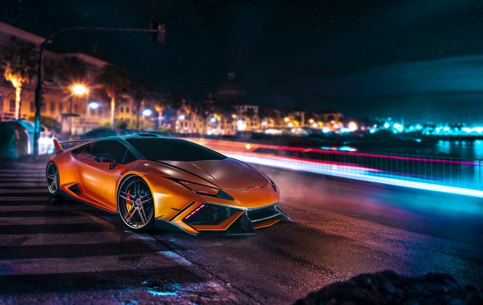 Orange Lamborghini Huracan driving at night