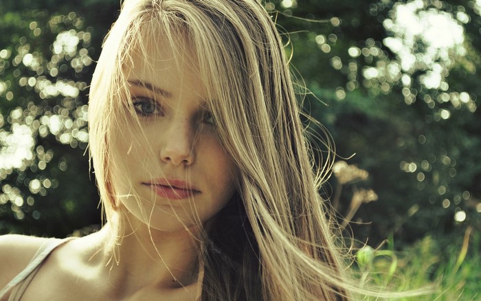Woman with blonde hair in the wind