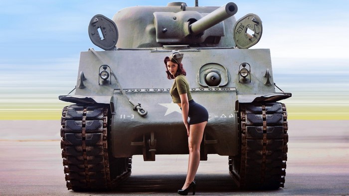Pinup model posing with M4 Sherman tank