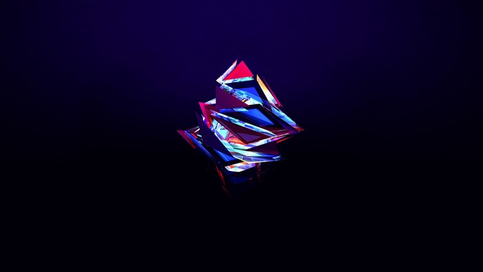 Abstract geometric glass sculpture with blue and red colors