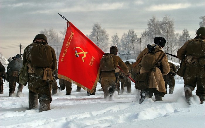 Soviet Soldiers Marching Through Snow with Red Flag
