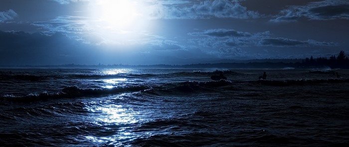 Moonlight Reflections on the Calm Sea at Night