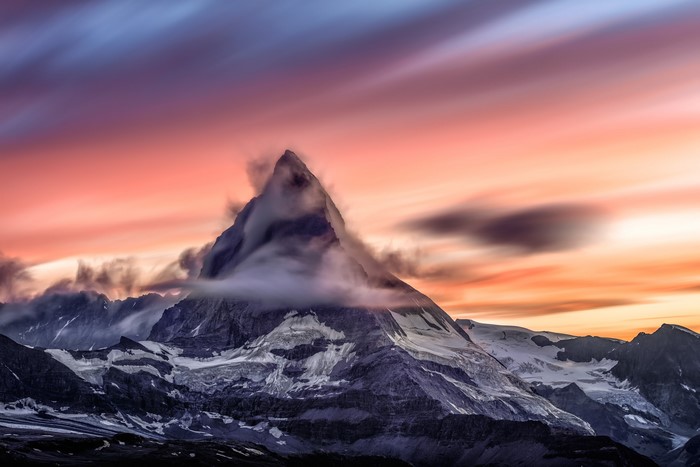 Matterhorn mountain at sunset with clouds and long exposure