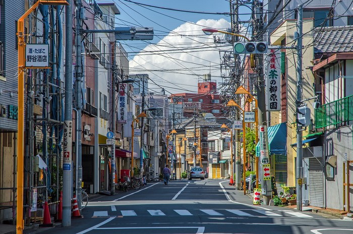 Street scene in Tokyo, Japan with buildings and signs