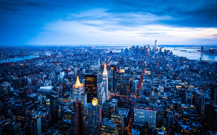 New York City skyline at dusk with city lights