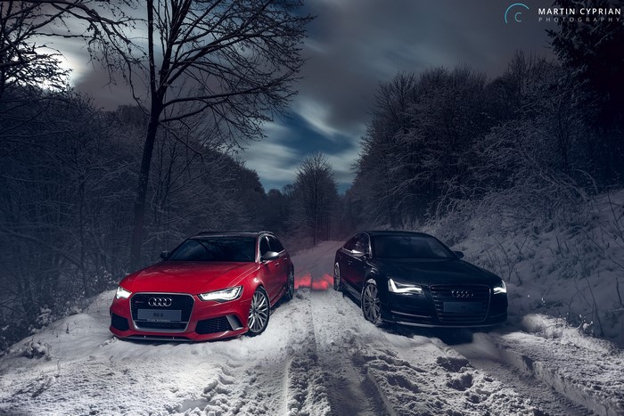 Audi RS6 Avant and Audi A8 in winter forest