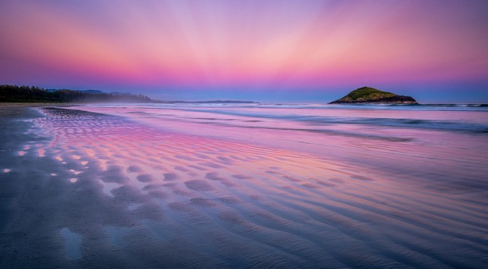 Beach sunset with island and colorful sky