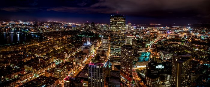 Boston cityscape at night with illuminated skyscrapers