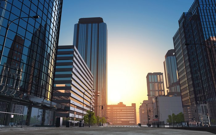 City street with skyscrapers at sunset