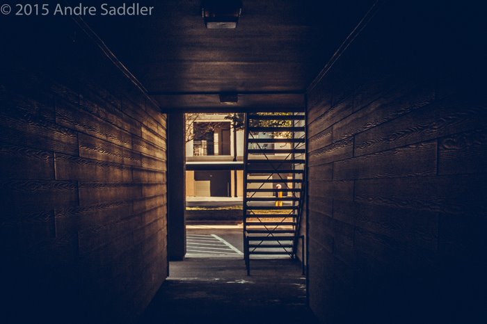Hallway with stairs and building exterior