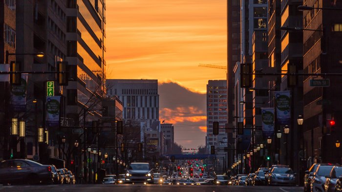 City street at sunset with traffic