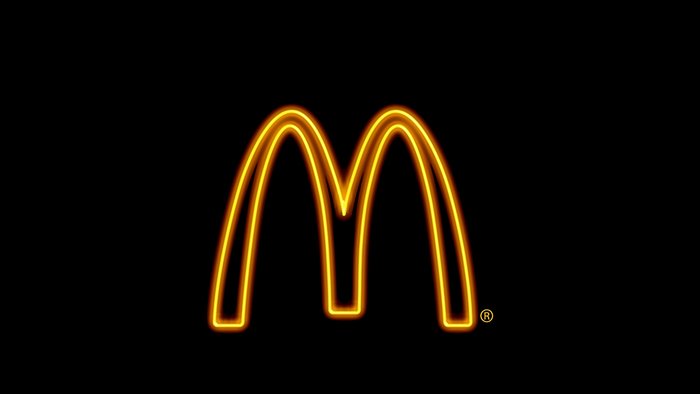 McDonald's logo neon light on black background