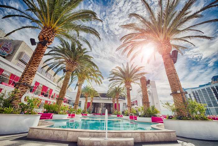 Luxury resort with palm trees and swimming pool in Las Vegas 4K