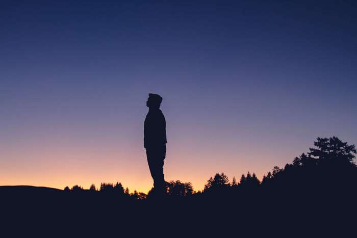 Silhouette of a man at sunset